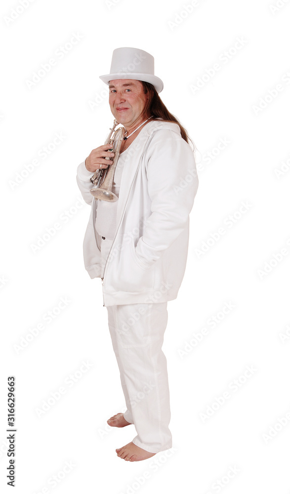 A trumpet player standing in a white outfit and hat in profile A trumpet player standing in a white outfit and hat in profile