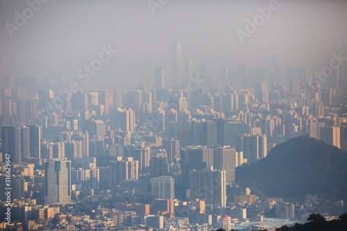 View of Guangzhou city with Zhujiang New Town from White Cloud Mountain, Baiyun Mountain, Guandong, China, sunny summer day photo