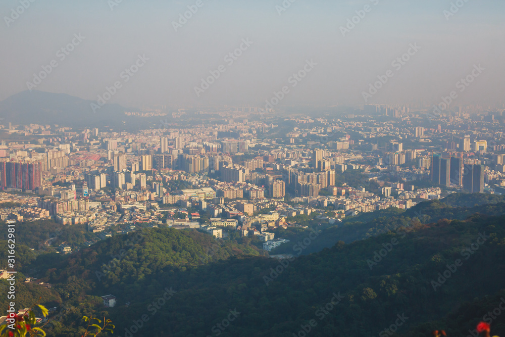 View of Guangzhou city with Zhujiang New Town from White Cloud Mountain, Baiyun Mountain, Guandong, China, sunny summer day