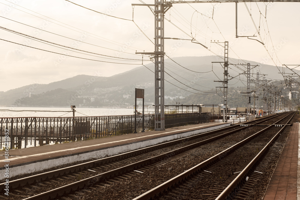 Empty railway with no train and people,selective focus and vintage style. Industrial concept background. Railroad travel, railway tourism. Transportation. Tourism day.