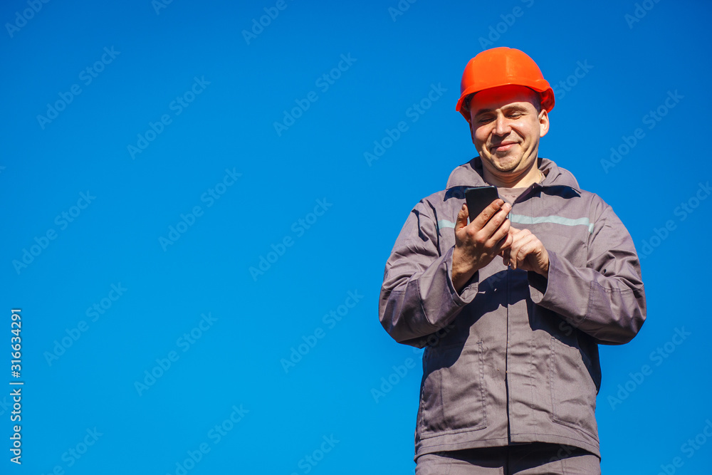 Engineer protective helmet stand in front of blue sky background. Contractor control according to plan. Builder engineer helmet works at construction site. Copy space. Engineer protective helmet stand in front of blue sky background. Contractor control according to plan. Builder engineer helmet works at construction site. Copy space.