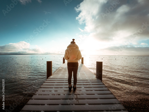 Woman standing on a dock