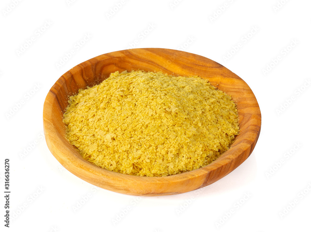 nutritional yeast flakes isolated on white background nutritional yeast flakes isolated on white background