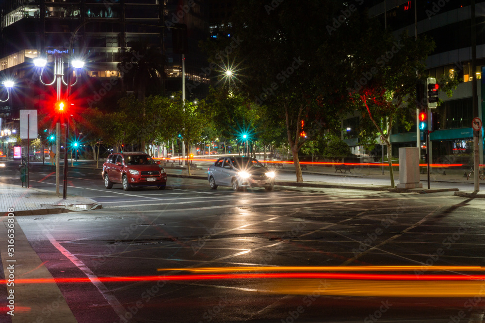 Fototapeta premium Lights and cars in movement in the streets of the city