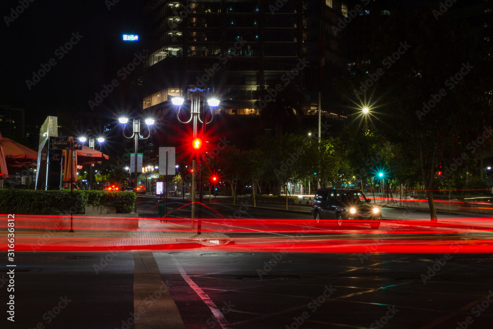 Red lights in motion during a night in the city
