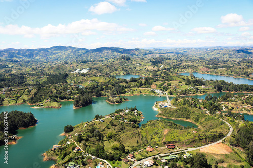 Fototapeta Naklejka Na Ścianę i Meble -  View of the lake landscapes of Guatape seen from Piedra del Peñol 