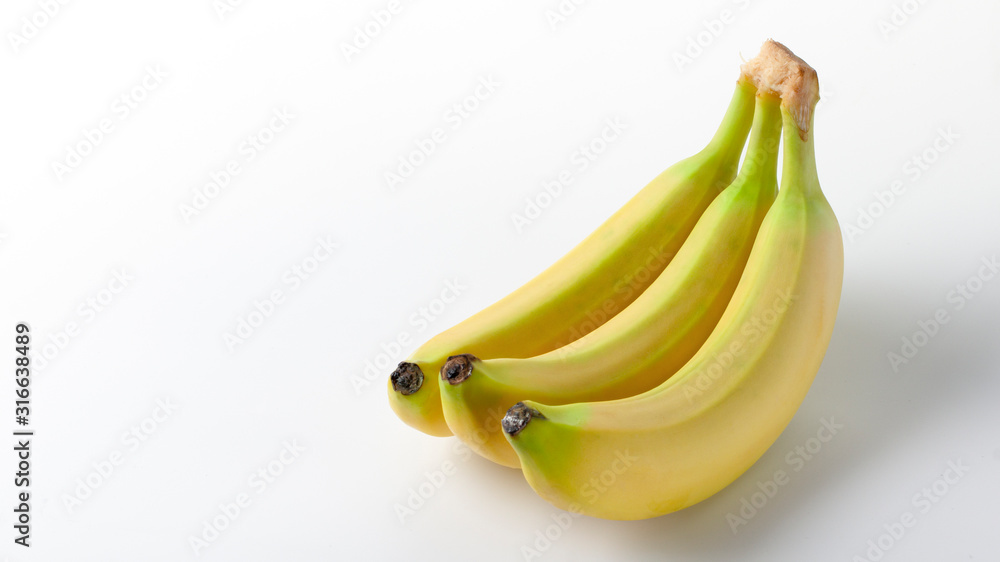 Three ripe little banana on a white background