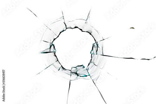 glass crack hole from a ball on a white background photo