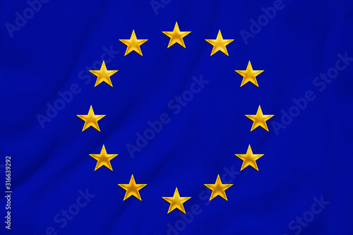 European Union flag, symbol of united Europe on soft silk with soft folds, close-up