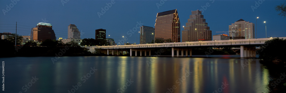 Naklejka premium This is the State Capitol and skyline at sunset. The city is on the Colorado River. It is called the live music capitol.