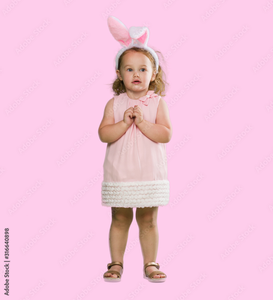 Lovely blonde toddler wearing easter bunny ears Lovely blonde toddler wearing easter bunny ears