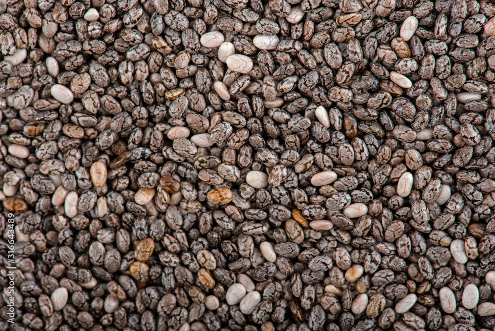 Chia closeup. The chia seeds. Healthy superfood. Top view. Chia closeup. The chia seeds. Healthy superfood. Top view.