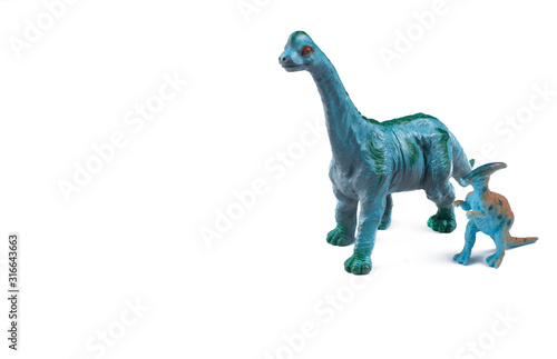 Toy dinosaurs isolated on white background.Copy space