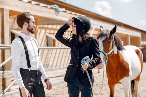 Horse theme. Businessman with a horse. Brunette with her friend © prostooleh