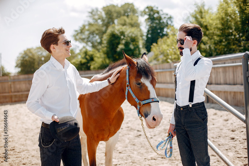 Horse theme. Businessmen with a horse. Men in a suit
