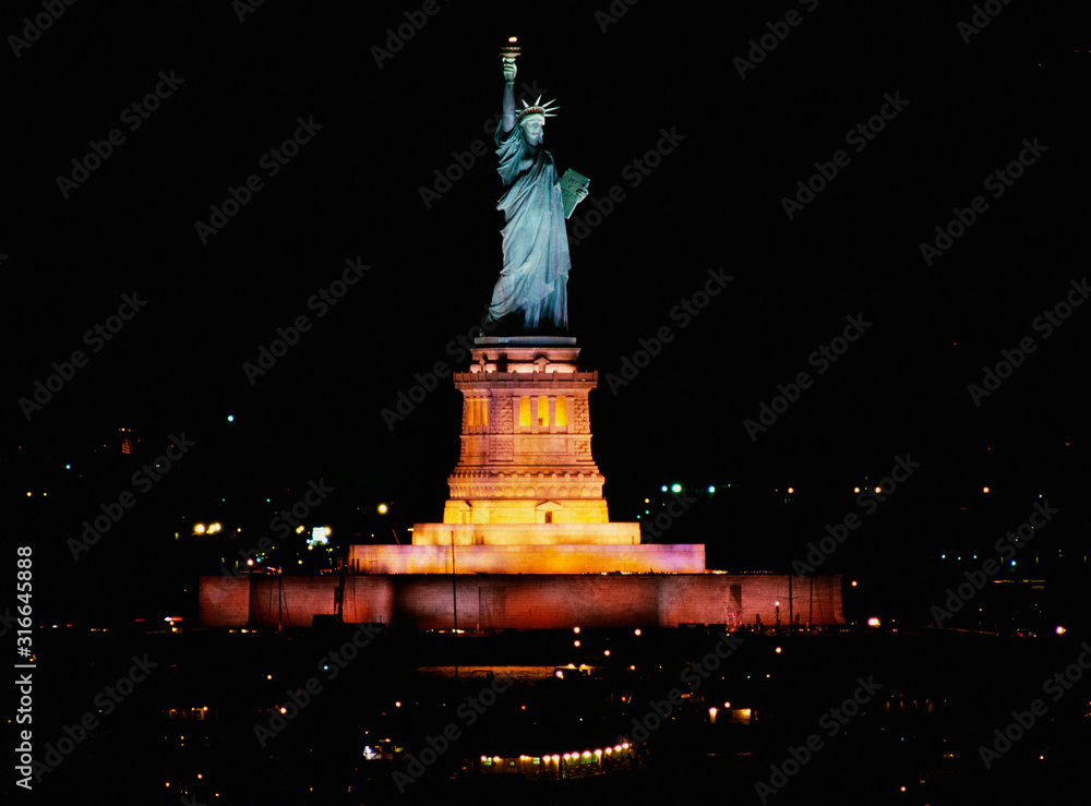 This is the Statue of Liberty lit up at night on Liberty Weekend. It