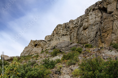 Mountain landscape. Sheer cliff and sky. Travel and adventure. © YUABOG