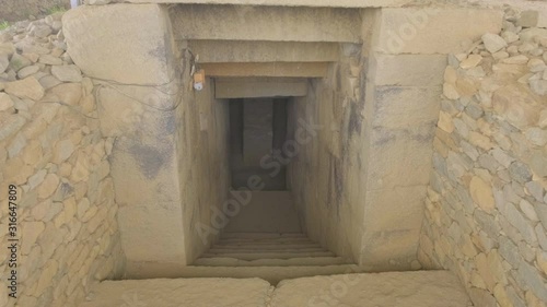 Camera forward push in down entrance stairs underground into internal chamber of the Tomb of King Kaleb in Aksum, Ethiopia