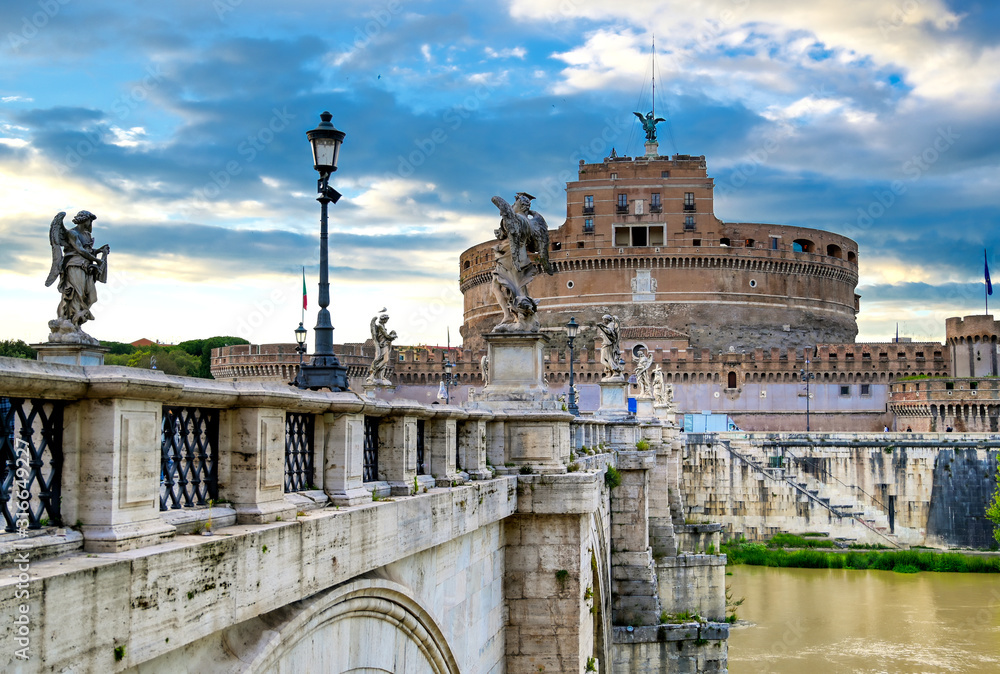 Castel Sant'Angelo and the St. Angelo Bridge located on the Tiber River in Rome, Italy.