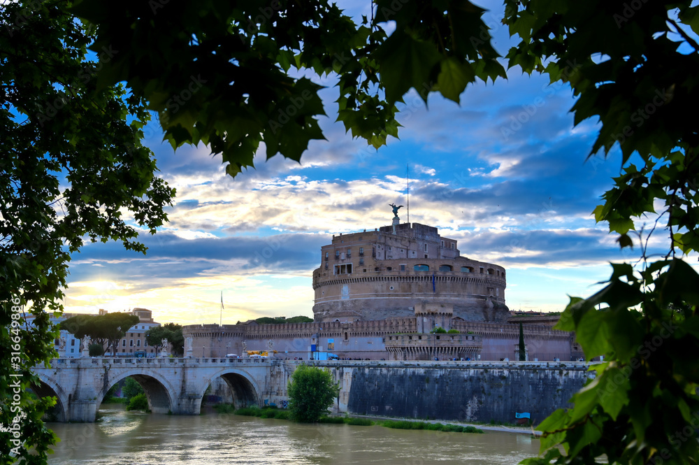Castel Sant'Angelo and the St. Angelo Bridge located on the Tiber River in Rome, Italy. Castel Sant'Angelo and the St. Angelo Bridge located on the Tiber River in Rome, Italy.