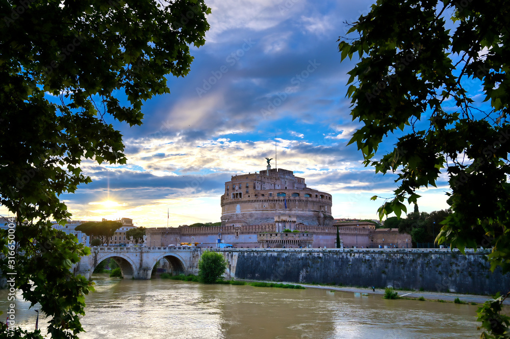 Castel Sant'Angelo and the St. Angelo Bridge located on the Tiber River in Rome, Italy.