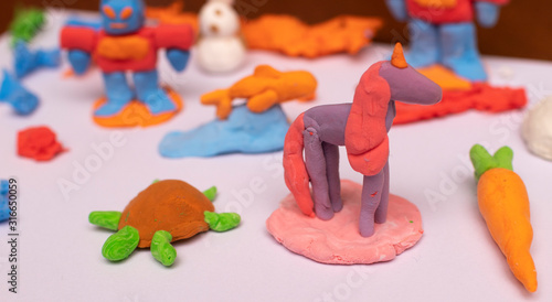 Plasticine unicorn, carrot, robot, turtle and fish