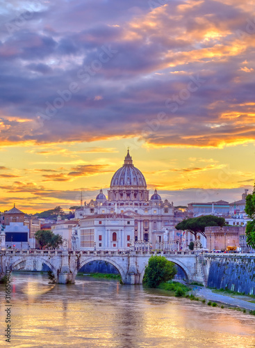 A view along the Tiber River towards St. Peter's Basilica and the Vatican in Rome, Italy.