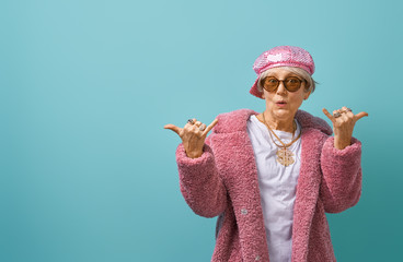 senior woman on color background.