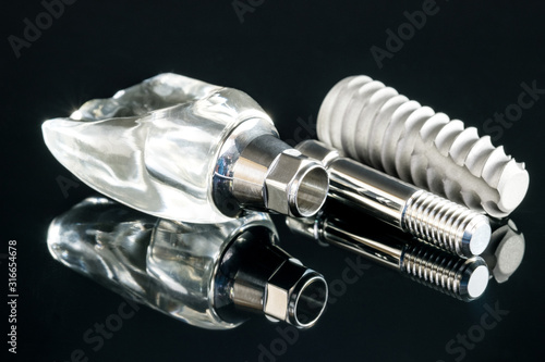 Close up dental implant  model on black background.
