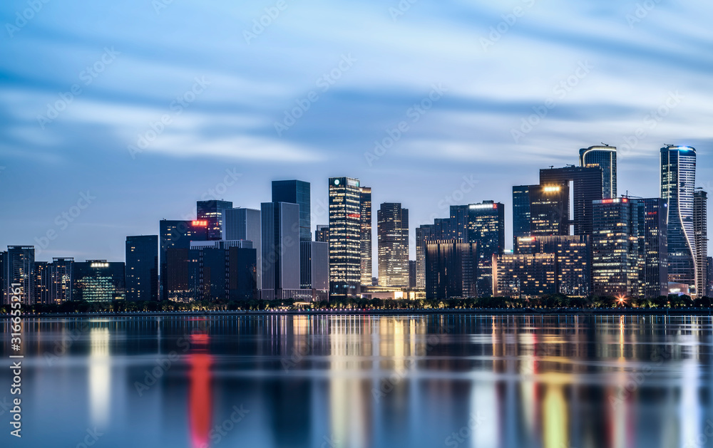 Night view of architectural landscape and urban skyline in Hangzhou Financial District..