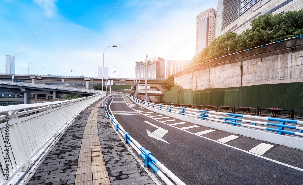 Urban road, bridge and urban building skyline..