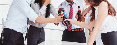 Canvas Print Group of business people professionals successful drink beers in office