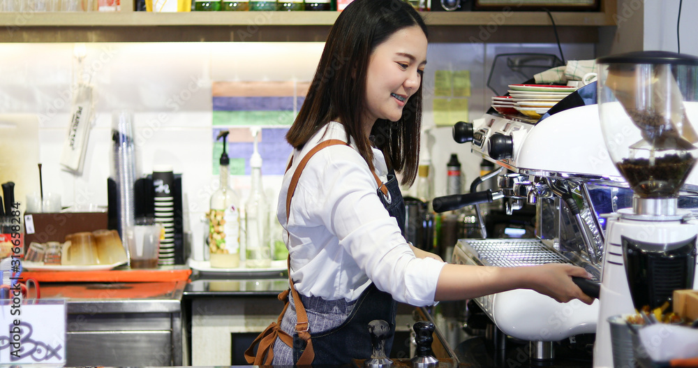 Asian women Barista smiling and using coffee machine in coffee shop counter - Working woman small business owner food and drink cafe concept Asian women Barista smiling and using coffee machine in coffee shop counter - Working woman small business owner food and drink cafe concept