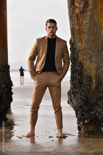 Sexy stylish man on the beach