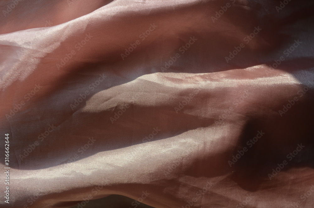 The abstract of the surface of the bright pink fabric that is exposed to sunlight. The abstract of the surface of the bright pink fabric that is exposed to sunlight.