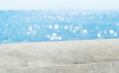 summer background.Empty diagonal grunge concrete table with blur sea and sky boekh background,banner mockup template for display of product