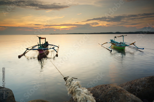 fishing boat at sunset