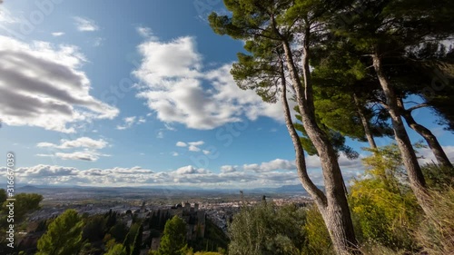Time Lapse - Partly cloudy sky over City of Granada in Spain. View from the back of Alhambra.