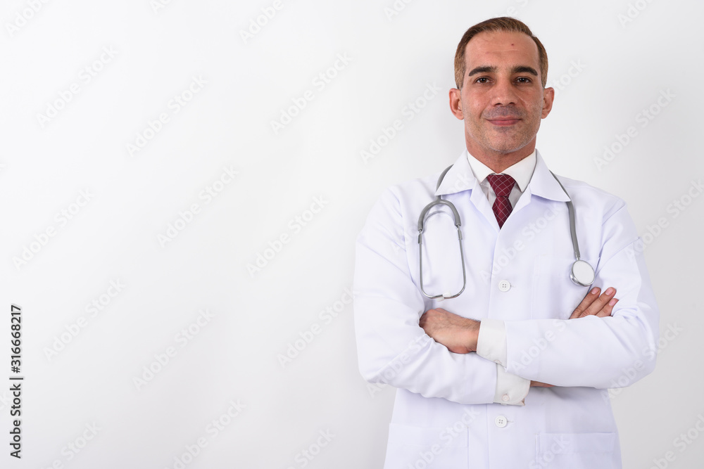 Portrait of mature handsome Persian man doctor Portrait of mature handsome Persian man doctor