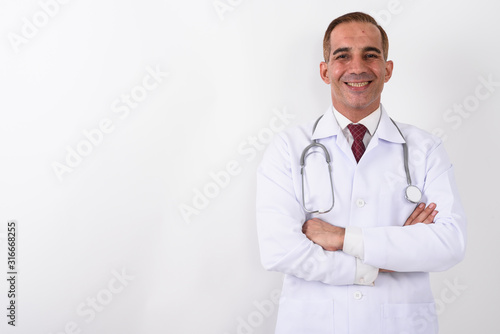 Portrait of mature handsome Persian man doctor © Ranta Images