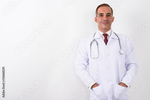 Portrait of mature handsome Persian man doctor