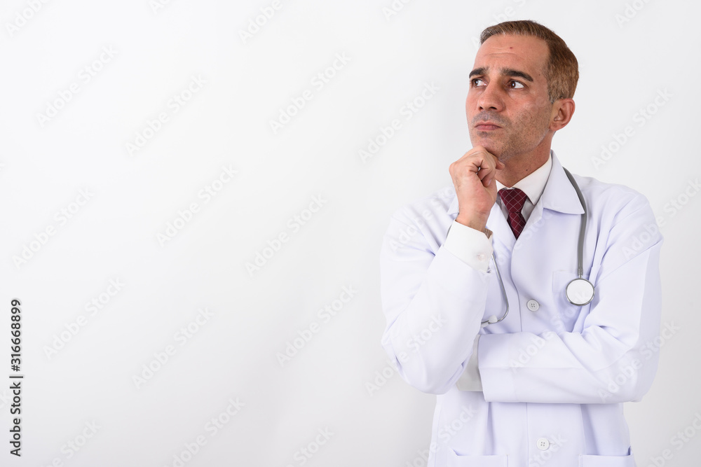 Portrait of mature handsome Persian man doctor Portrait of mature handsome Persian man doctor