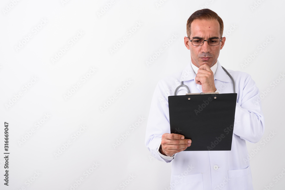 Portrait of mature handsome Persian man doctor Portrait of mature handsome Persian man doctor