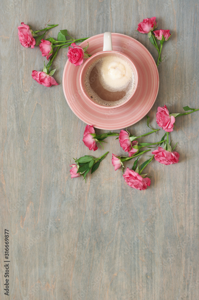 Cup of creamy coffee with flowers decor Cup of creamy coffee with flowers decor