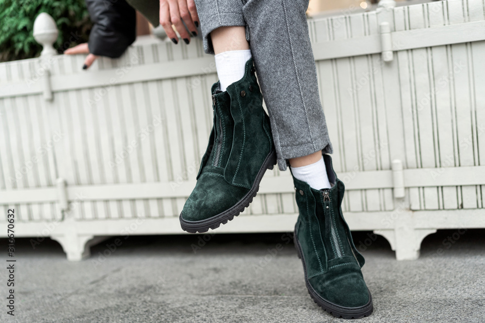 real-life green womens low boots nubuck demi season flat shoes on legs of a model in the street real-life green womens low boots nubuck demi season flat shoes on legs of a model in the street