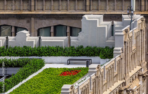 Photography Bird's eye aerial view of a rooftop garden on an ornate roof of a skyscraper in