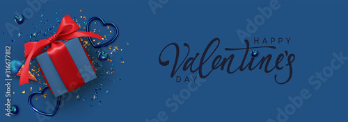 Happy Valentine's Day. Horizontal banner, header template for the website. Romantic realistic design elements, gift box, metal hearts strewn with sparkles confetti. Handwritten calligraphy lettering.