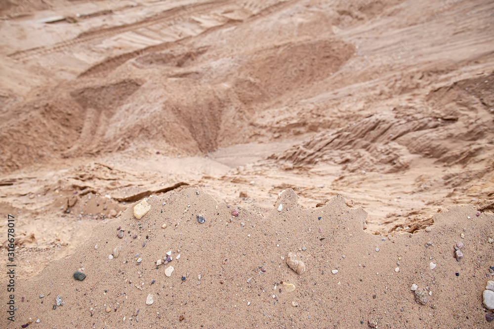 Dangerous edge of the sand quarry and steep cliff down. Quarrying and mining of building material. Dangerous edge of the sand quarry and steep cliff down. Quarrying and mining of building material.