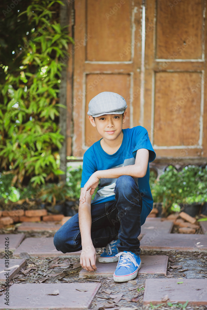 Teenage handsome boy pose portrait in the park Teenage handsome boy pose portrait in the park