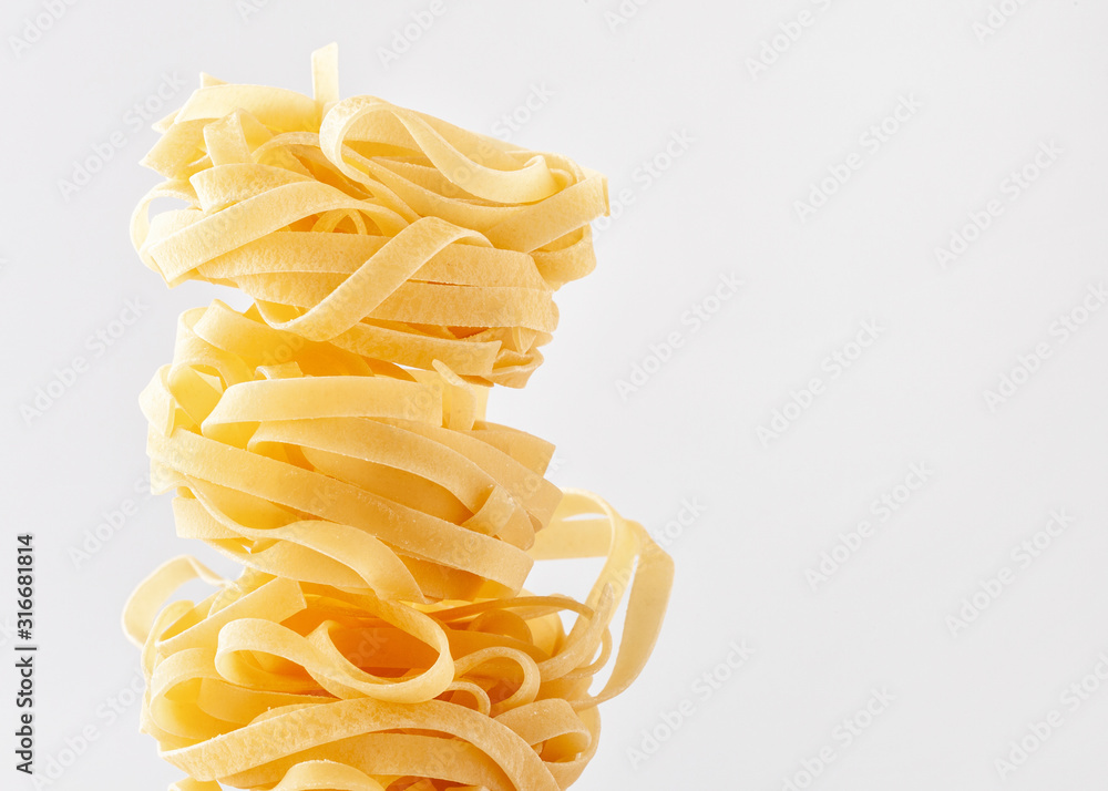 Fettuccine. Pasta on white background. Fettuccine. Pasta on white background.